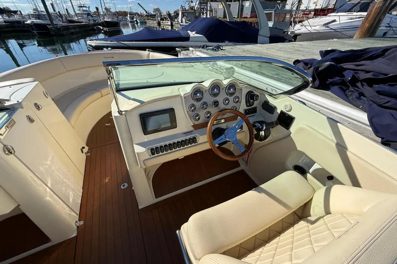 Slide: The Image of 2018 Chris-Craft Launch 30 boat interior with elegant dashboard and leather seating. - 28