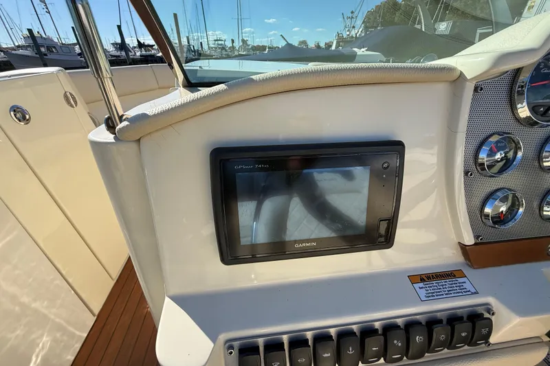 Slide: The Image of 2018 Chris-Craft Launch 30 dashboard with Garmin GPS and control panel. - 31