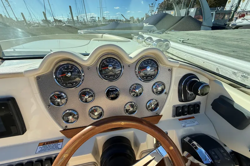 Slide: The Image of Dashboard of a 2018 Chris-Craft Launch 30 boat with gauges and controls. - 32