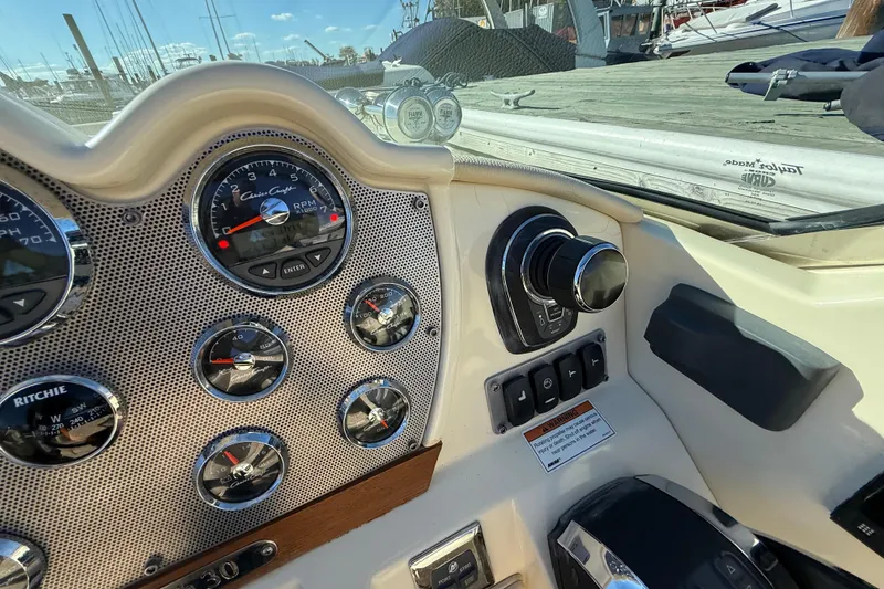 Slide: The Image of Dashboard of a 2018 Chris-Craft Launch 30 boat with gauges and controls. - 33