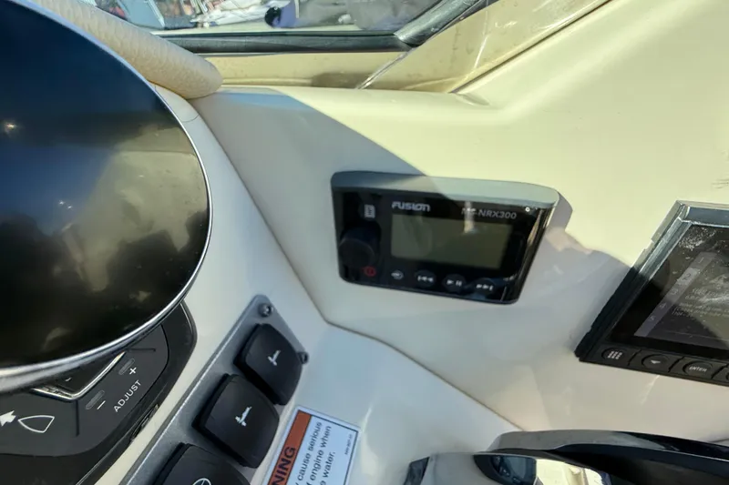 Slide: The Image of Control panel of a 2018 Chris-Craft Launch 30 boat with Fusion marine stereo. - 36