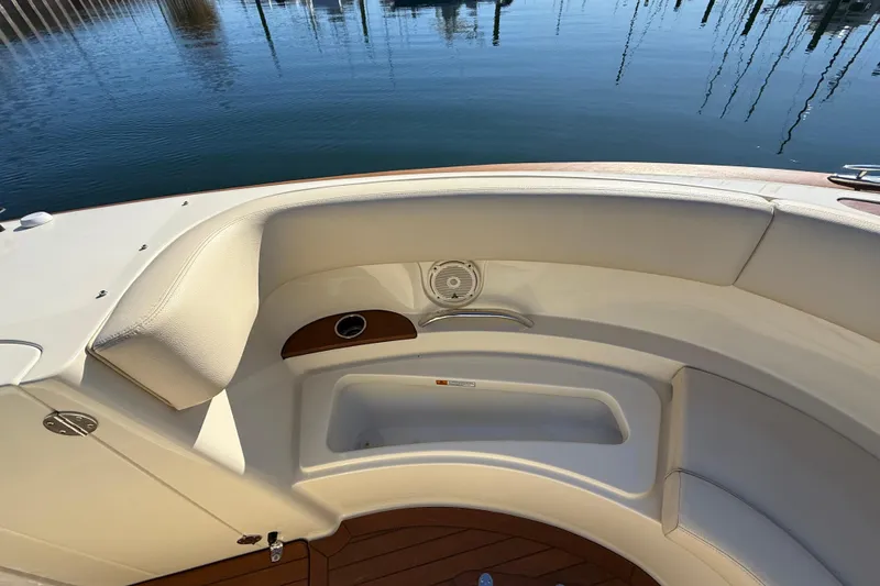 Slide: The Image of 2018 Chris-Craft Launch 30 boat interior with white seating and wooden accents. - 43