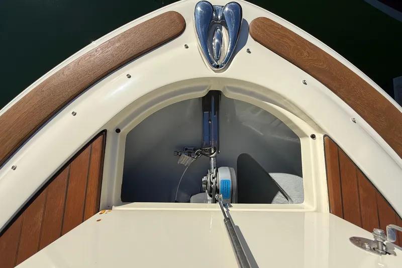 Slide: The Image of 2018 Chris-Craft Launch 30 boat bow with wood accents and anchor storage. - 47