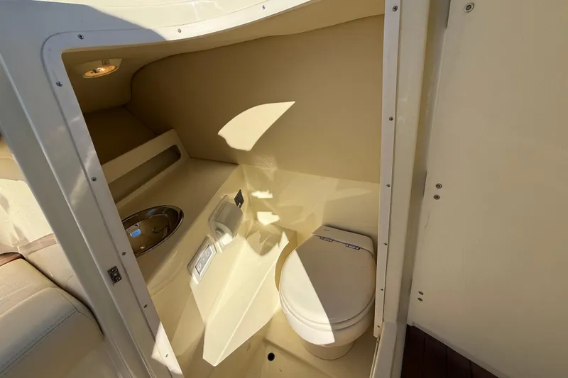 Slide: The Image of 2018 Chris-Craft Launch 30 boat interior with compact bathroom and toilet. - 48