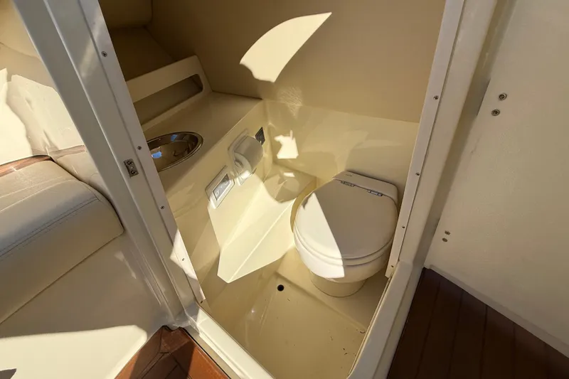 Slide: The Image of 2018 Chris-Craft Launch 30 boat interior with compact bathroom and toilet. - 49