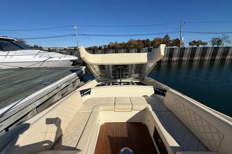 Slide: The Image of 2018 Chris-Craft Launch 30 boat interior with beige seating and open engine compartment. - 9