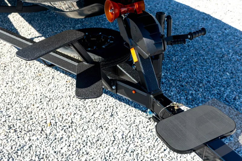 Slide: The Image of Trailer hitch of 2026 Skeeter ZXE20 on gravel surface, featuring sturdy construction. - 10