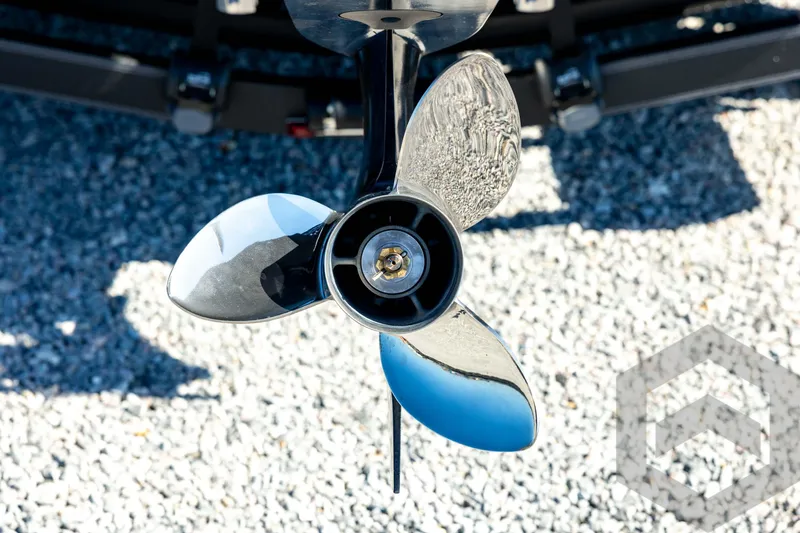 Slide: The Image of Propeller of 2026 Skeeter ZXE20 boat on gravel surface. - 21