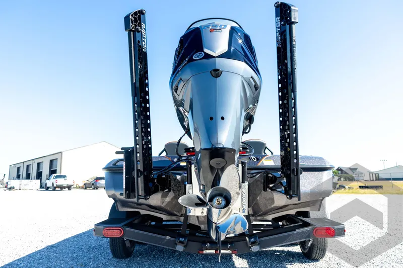 Slide: The Image of 2026 Skeeter ZXE20 boat rear view with powerful outboard motor and dual power poles. - 22