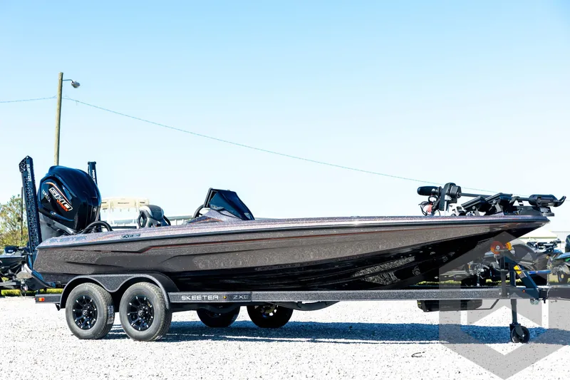 Slide: The Image of 2026 Skeeter ZXE20 boat on trailer, sleek design, dual axles, outdoor display. - 3