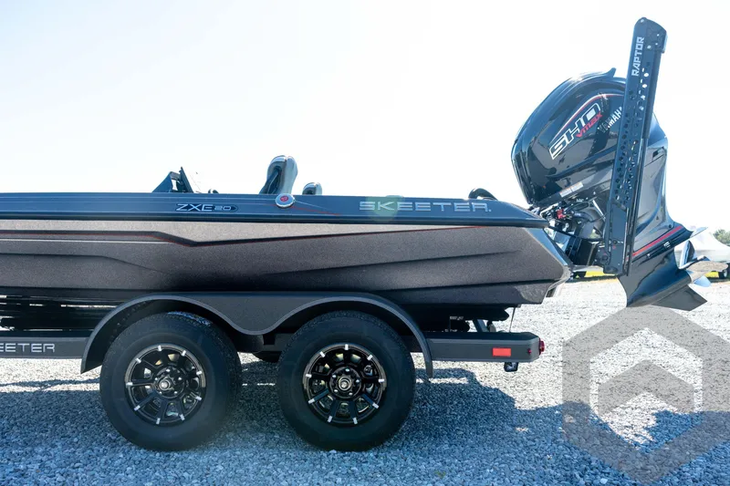 Slide: The Image of 2026 Skeeter ZXE20 boat with Yamaha engine on a trailer, parked on gravel. - 31