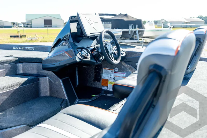 Slide: The Image of 2026 Skeeter ZXE20 boat interior with modern dashboard and seating. - 34