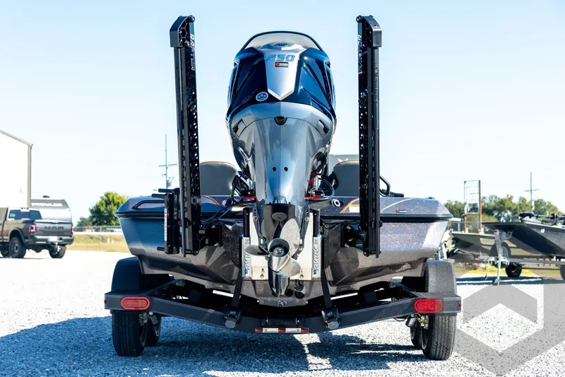 Slide: The Image of 2026 Skeeter ZXE20 boat with powerful outboard motor, rear view on trailer. - 5