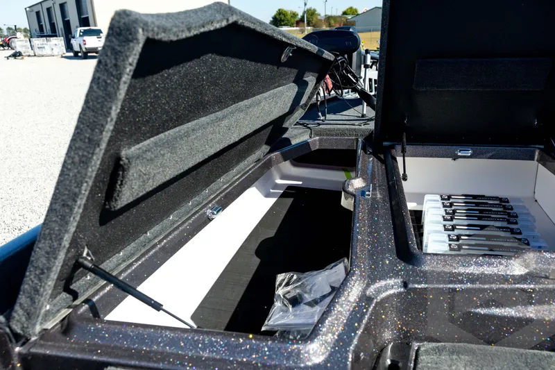 Slide: The Image of Open storage compartments in a 2026 Skeeter ZXE20 boat, showcasing organized interior space. - 50