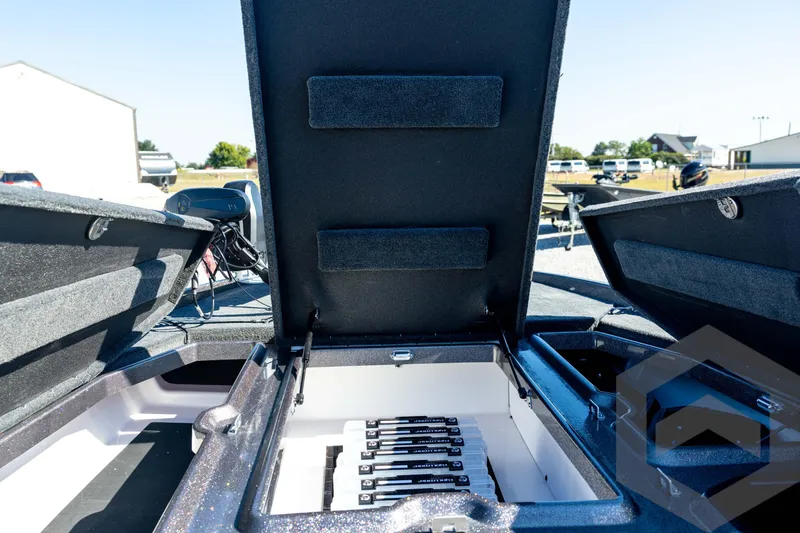 Slide: The Image of 2026 Skeeter ZXE20 boat storage compartments open, showcasing interior organization. - 51