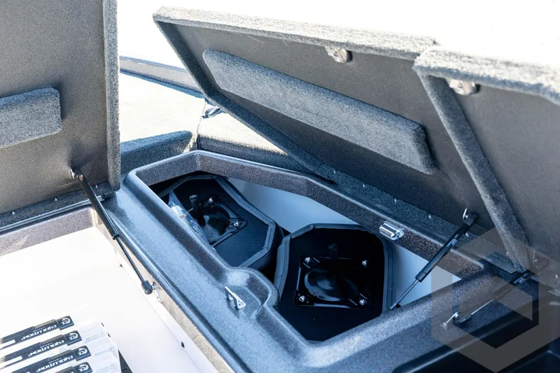 Slide: The Image of Open storage compartments in a 2026 Skeeter ZXE20 boat, showcasing interior design. - 52