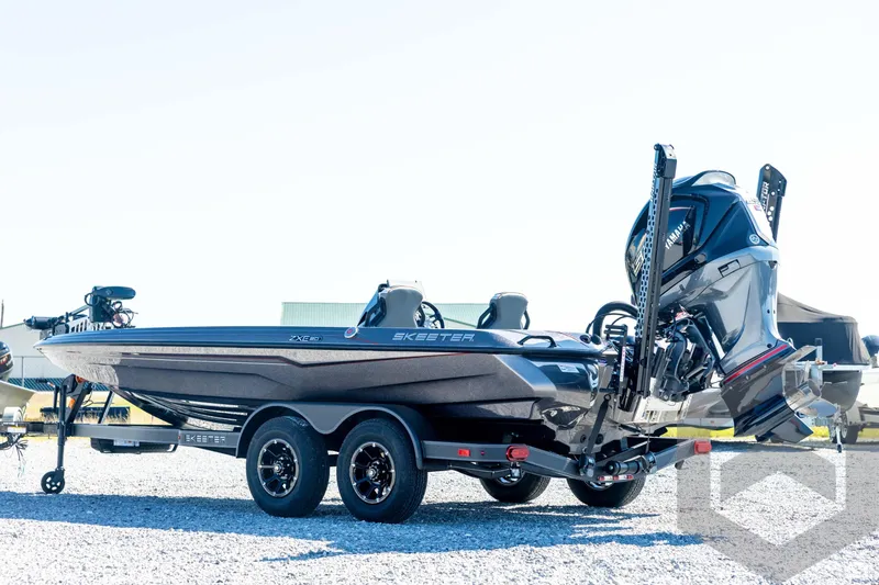 Slide: The Image of 2026 Skeeter ZXE20 boat on trailer, featuring dual motors and sleek design. - 6