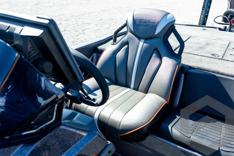 Slide: The Image of 2026 Skeeter ZXE20 boat interior with sleek, modern seat design and steering console. - 62