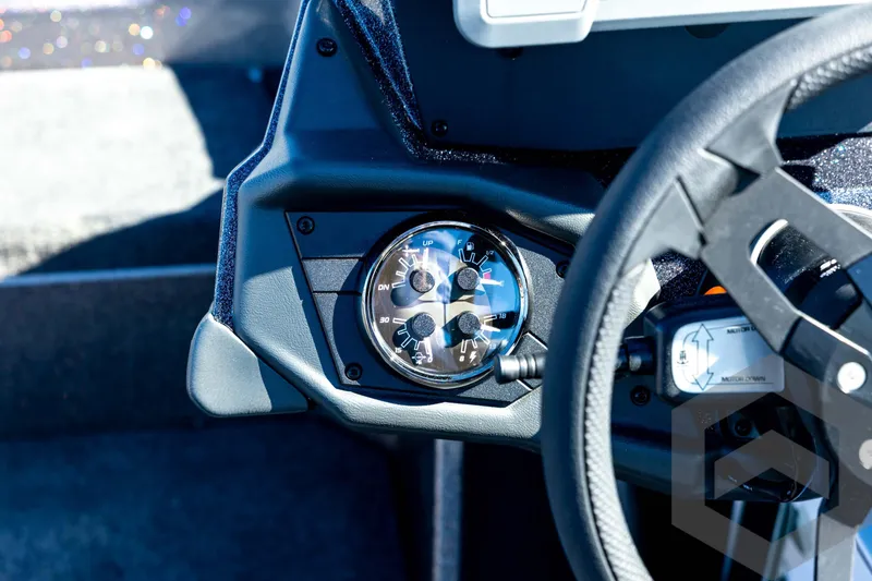 Slide: The Image of 2026 Skeeter ZXE20 dashboard with steering wheel and instrument panel. - 64
