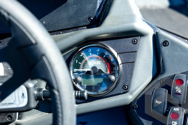 Slide: The Image of Close-up of 2026 Skeeter ZXE20 dashboard with tachometer and control panel. - 67