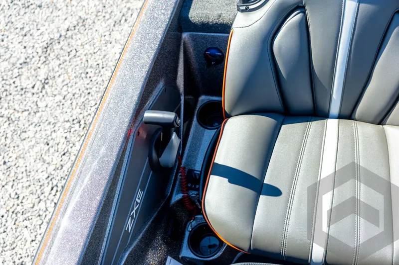 Slide: The Image of 2026 Skeeter ZXE20 boat seat with sleek design and cup holders. - 69