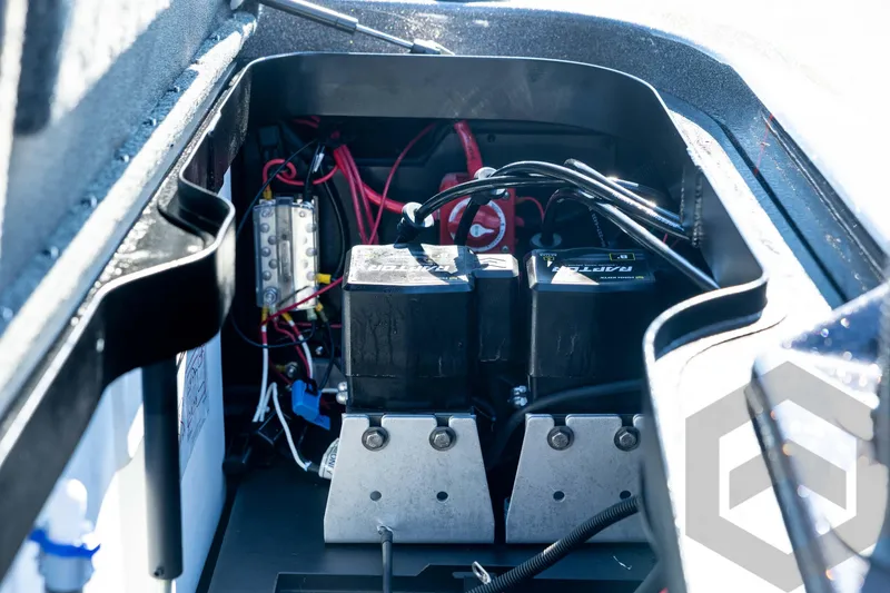 Slide: The Image of Battery compartment of 2026 Skeeter ZXE20 boat with wiring and components. - 80
