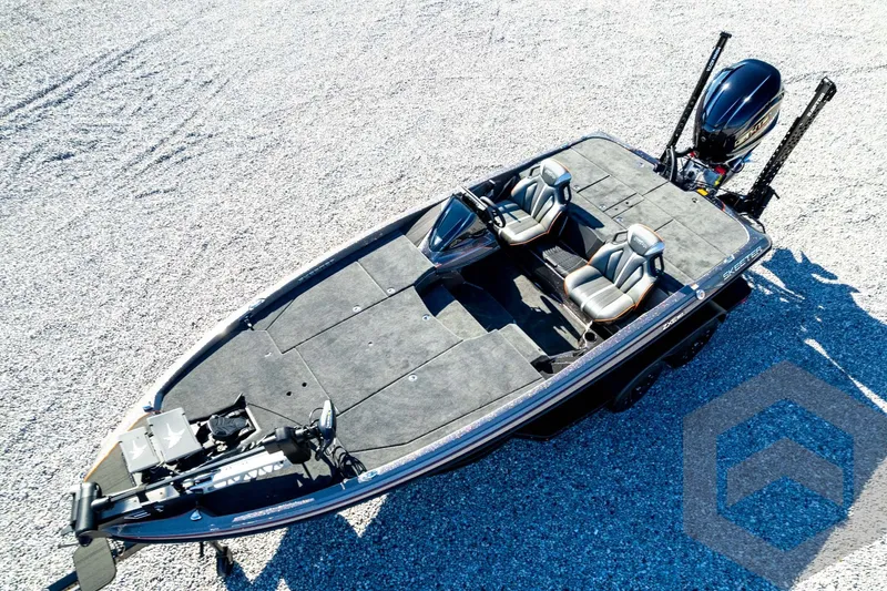 Slide: The Image of 2026 Skeeter ZXE20 fishing boat with dual seats and modern design on gravel surface. - 85