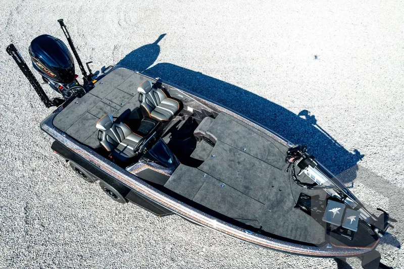 Slide: The Image of 2026 Skeeter ZXE20 fishing boat with dual seats and advanced equipment on gravel surface. - 87