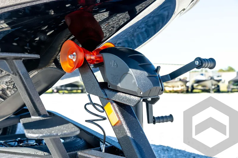 Slide: The Image of 2026 Skeeter ZXE20 boat trailer with winch and roller, close-up view. - 9
