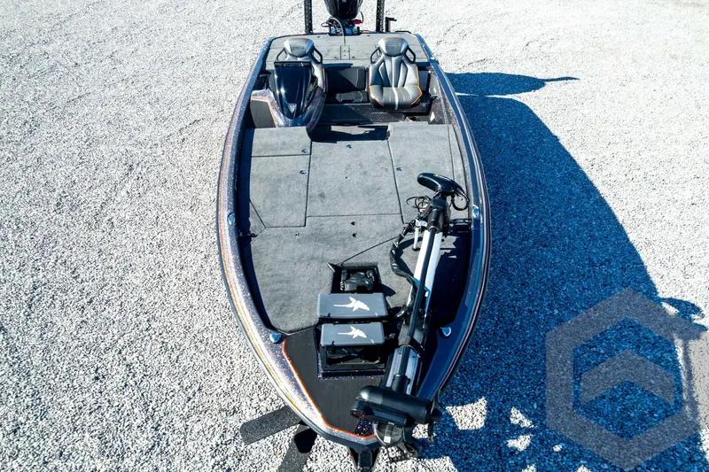 Slide: The Image of 2026 Skeeter ZXE20 fishing boat on gravel, featuring spacious deck and modern seating. - 91