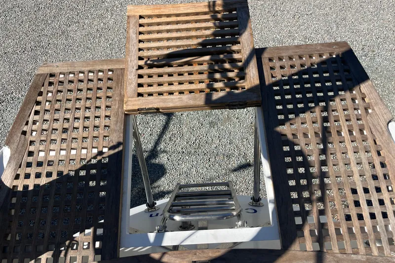 Slide: The Image of Wooden deck of 1993 Med Marine Montevideo 43 yacht with metal ladder. - 11