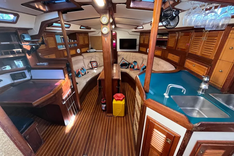 Slide: The Image of Luxurious interior of 1993 Med Marine Montevideo 43 yacht with wood finishes and modern amenities. - 19