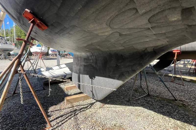 Slide: The Image of Underneath view of 1993 Med Marine Montevideo 43 yacht on stands in a boatyard. - 2