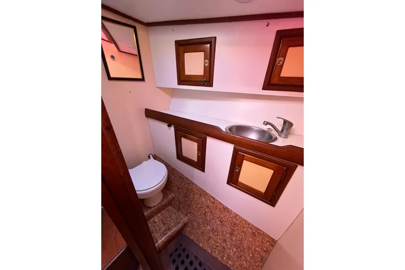 Slide: The Image of Bathroom interior of 1993 Med Marine Montevideo 43 yacht with sink and toilet. - 21