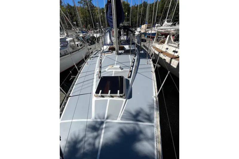 Slide: The Image of Sailboat deck of 1993 Med Marine Montevideo 43, surrounded by other boats in marina. - 5