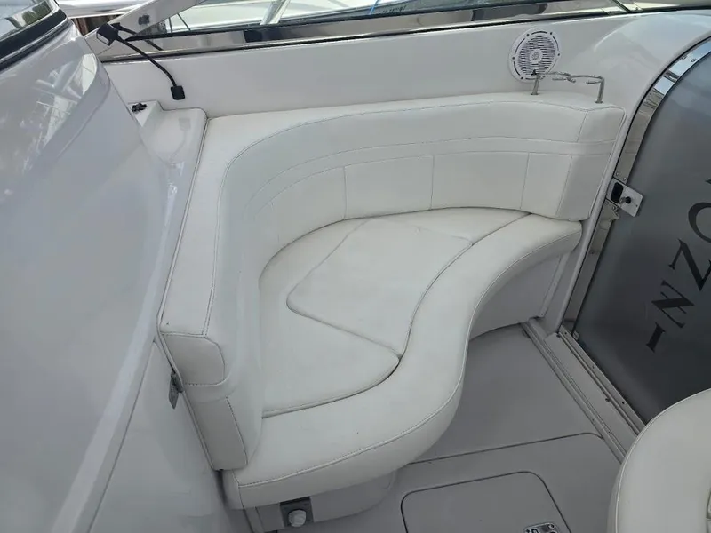 Slide: The Image of 2008 Donzi 38 ZSF boat interior with white leather seating and speaker. - 10