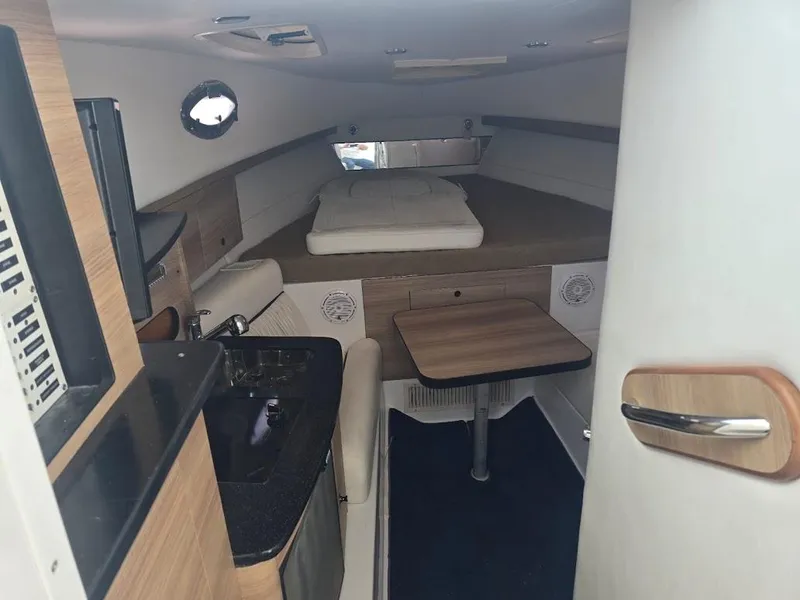 Slide: The Image of Interior of 2008 Donzi 38 ZSF boat with kitchenette and seating area. - 11