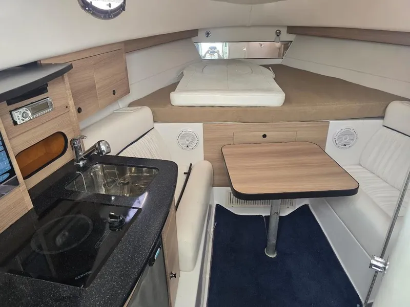 Slide: The Image of Interior of 2008 Donzi 38 ZSF boat with kitchenette, seating, and bed. - 12