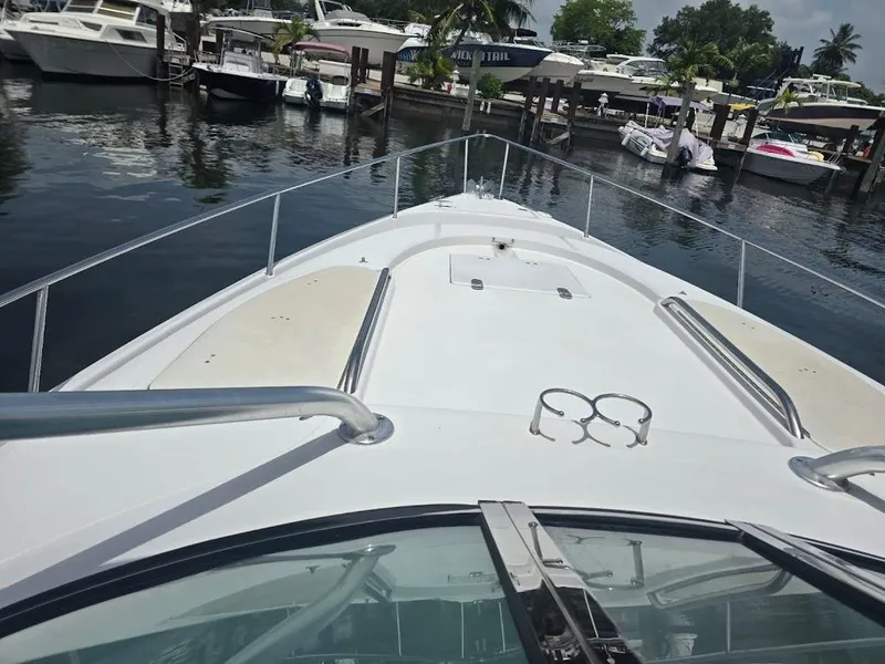 Slide: The Image of 2008 Donzi 38 ZSF boat docked at marina, view from bow. - 3