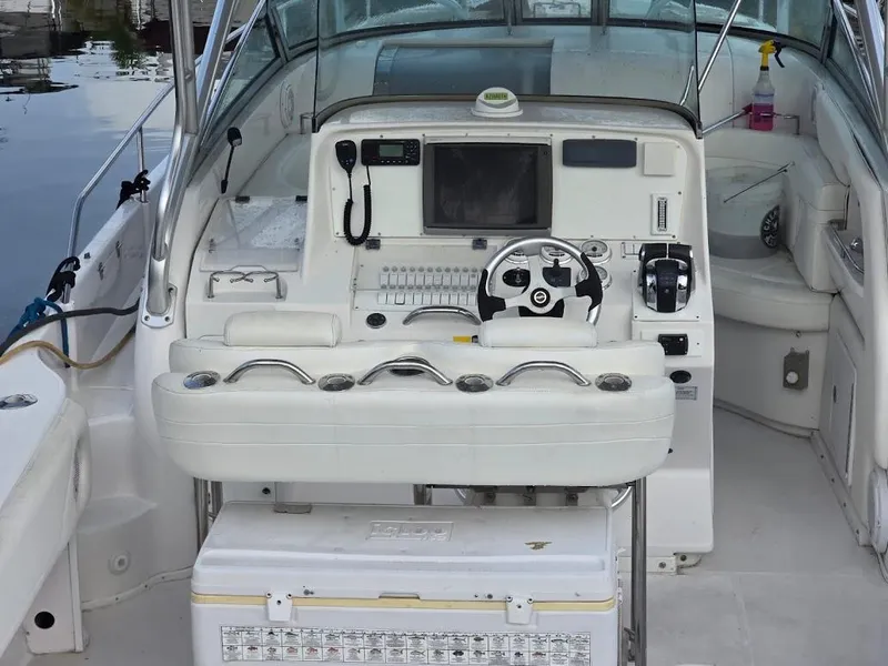 Slide: The Image of 2008 Donzi 38 ZSF boat cockpit with steering wheel and control panel. - 4
