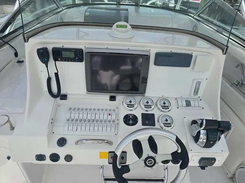 Slide: The Image of Control panel of a 2008 Donzi 38 ZSF boat with steering wheel and gauges. - 6
