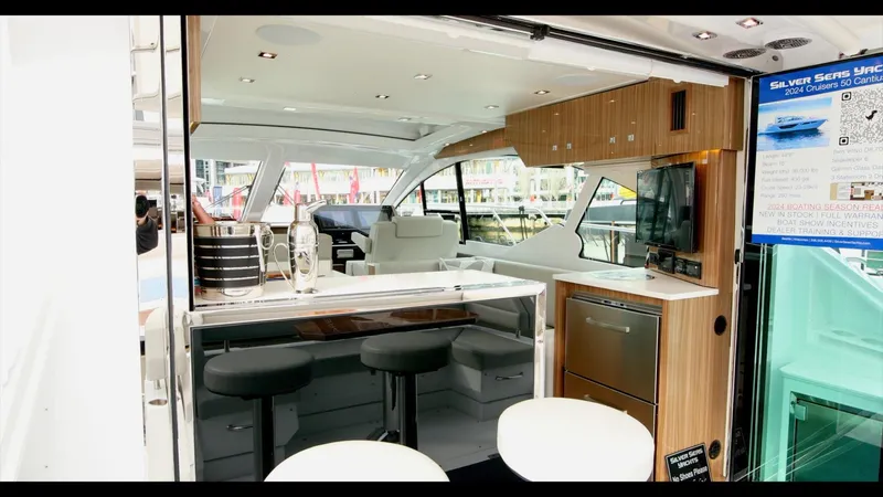 Slide: The Image of 2024 Cruisers Yachts 50 Cantius interior with modern kitchen and seating area. - 27