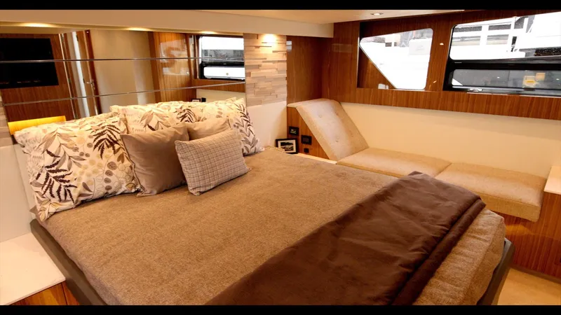 Slide: The Image of Luxurious bedroom interior of 2024 Cruisers Yachts 50 Cantius with modern decor and large windows. - 48