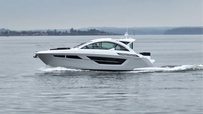 Slide: The Image of 2024 Cruisers Yachts 50 Cantius cruising on calm waters. - 5