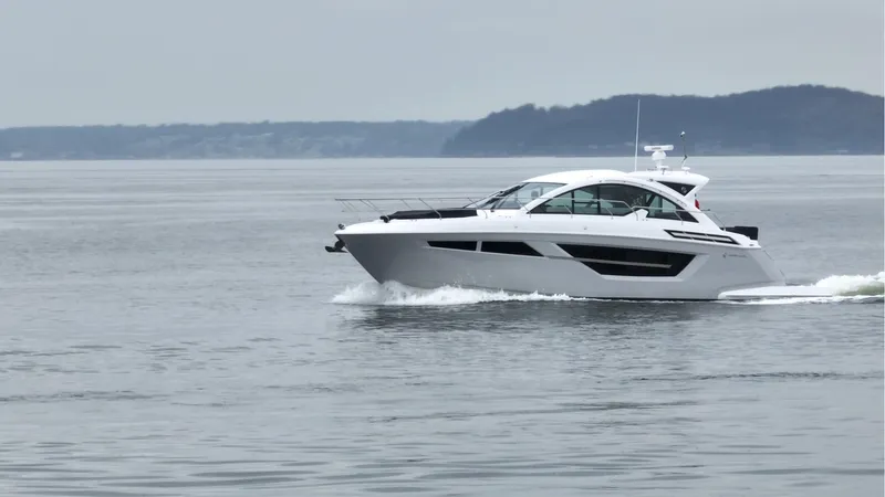 Slide: The Image of 2024 Cruisers Yachts 50 Cantius cruising on calm waters. - 6
