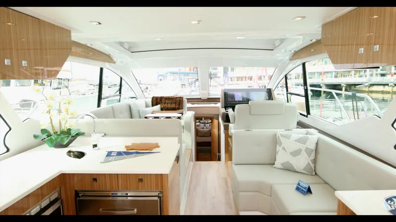 Slide: The Image of Luxurious interior of 2024 Cruisers Yachts 50 Cantius with modern furnishings and large windows. - 31