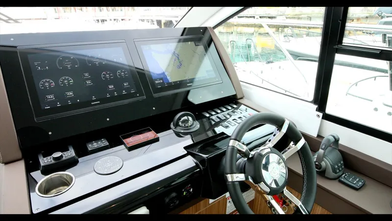 Slide: The Image of 2024 Cruisers Yachts 50 Cantius helm with advanced navigation and control systems. - 36