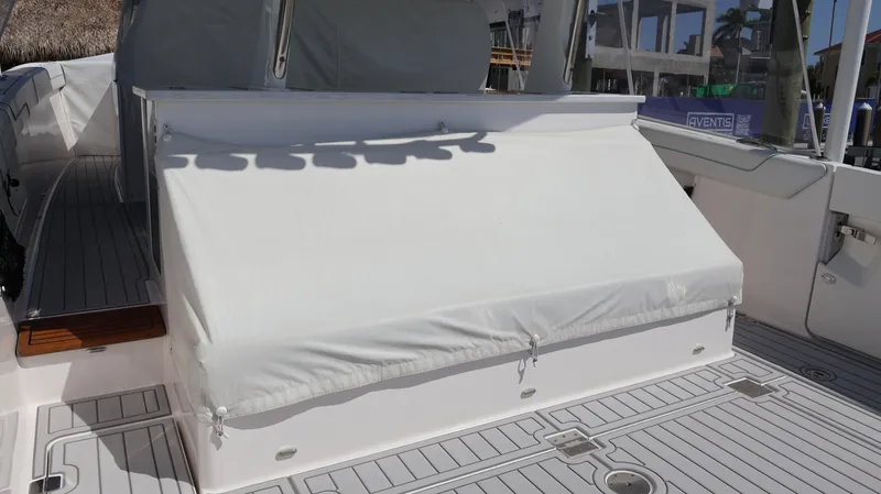 Slide: The Image of 2022 Regal 38 SAV boat with covered seating area on deck. - 14