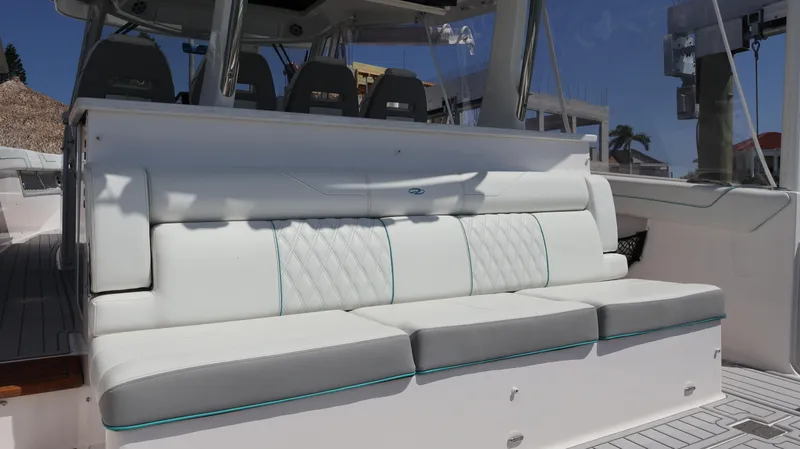 Slide: The Image of 2022 Regal 38 SAV boat with luxurious white seating and modern design. - 15