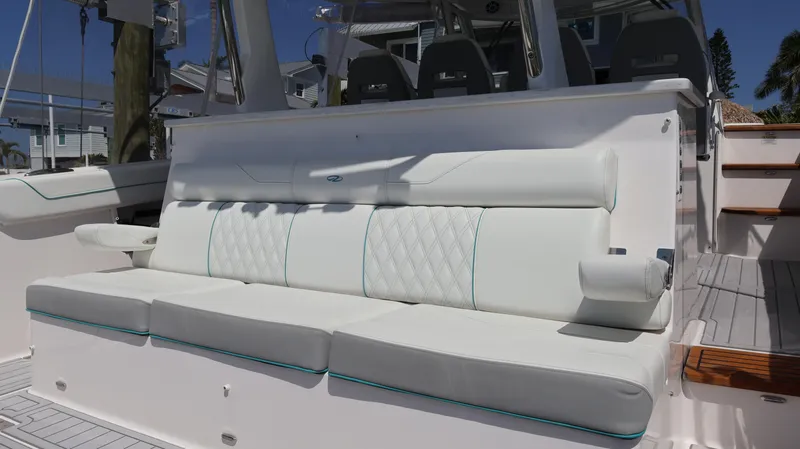 Slide: The Image of 2022 Regal 38 SAV boat with luxurious white seating and modern design. - 16